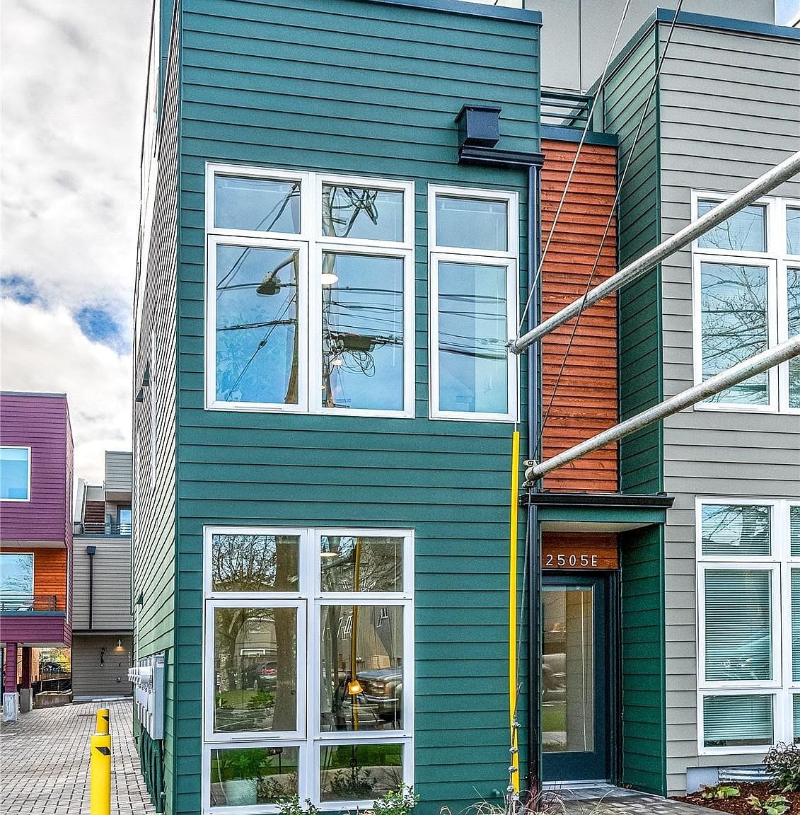 Townhome exteriors in the project's colors
