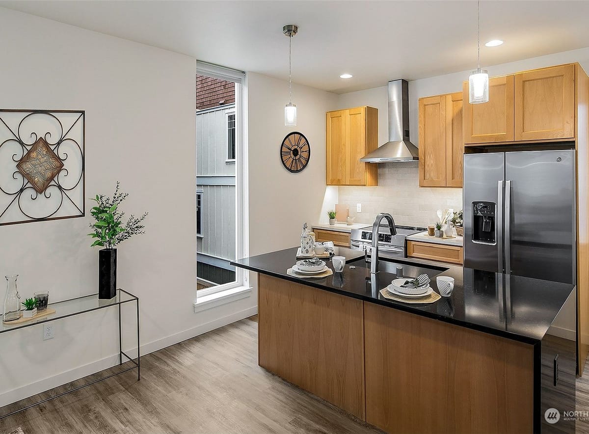 Kitchen with island and stainless appliances