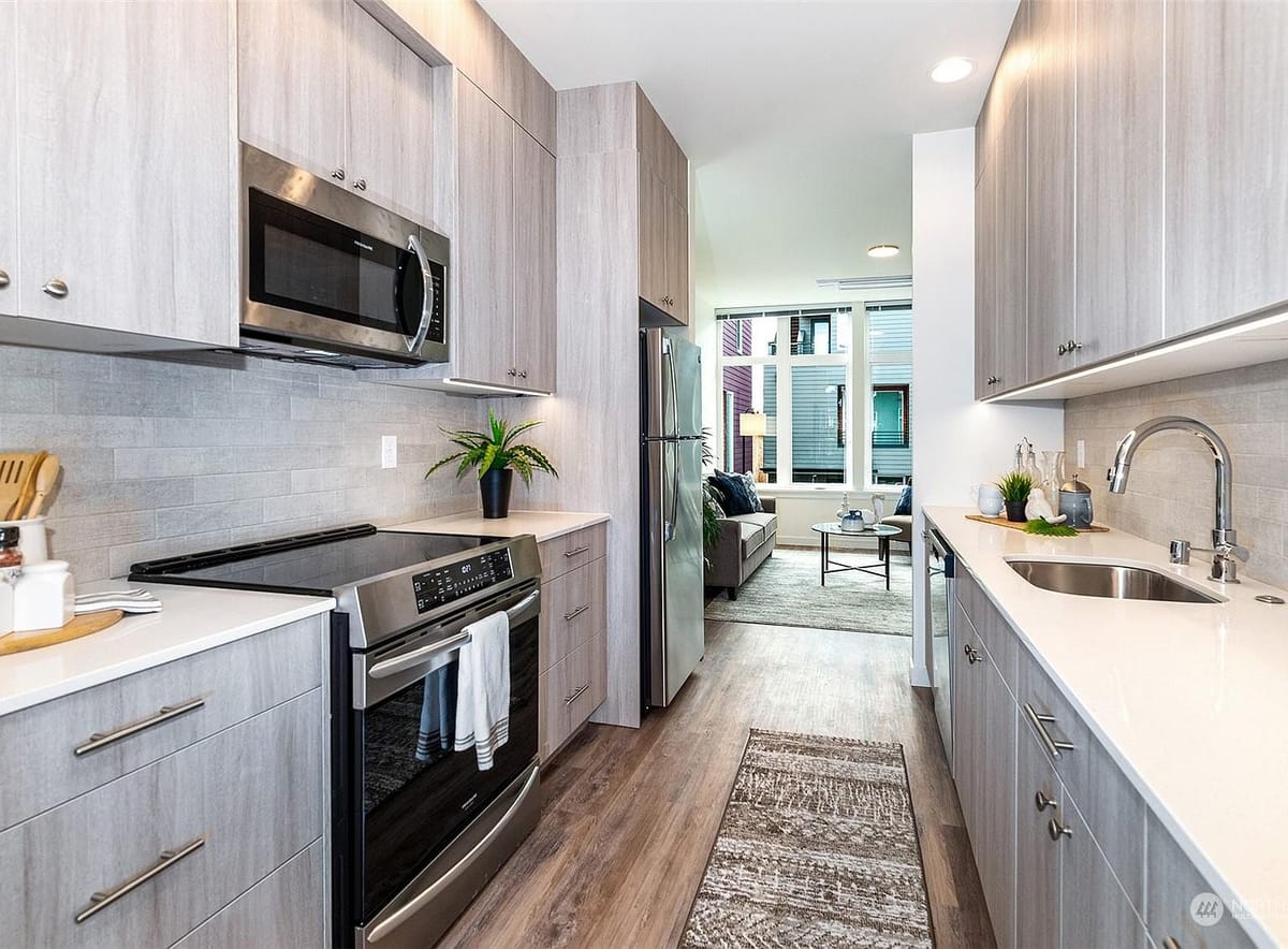Galley kitchen with quartz counters